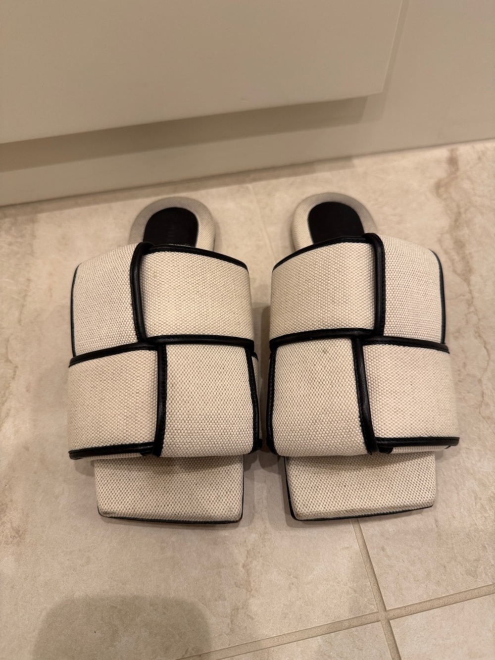 Bottega Veneta Ivory Woven Slide Sandals with Black Piping